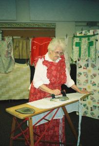 She displayed the vintage aprons on a clothesline around the room. 